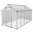 Zilveren tuinkas van polycarbonaat, 180 x 320 x 194 cm, met transparante wanden en een schuifdeur voor optimale lichtinval
