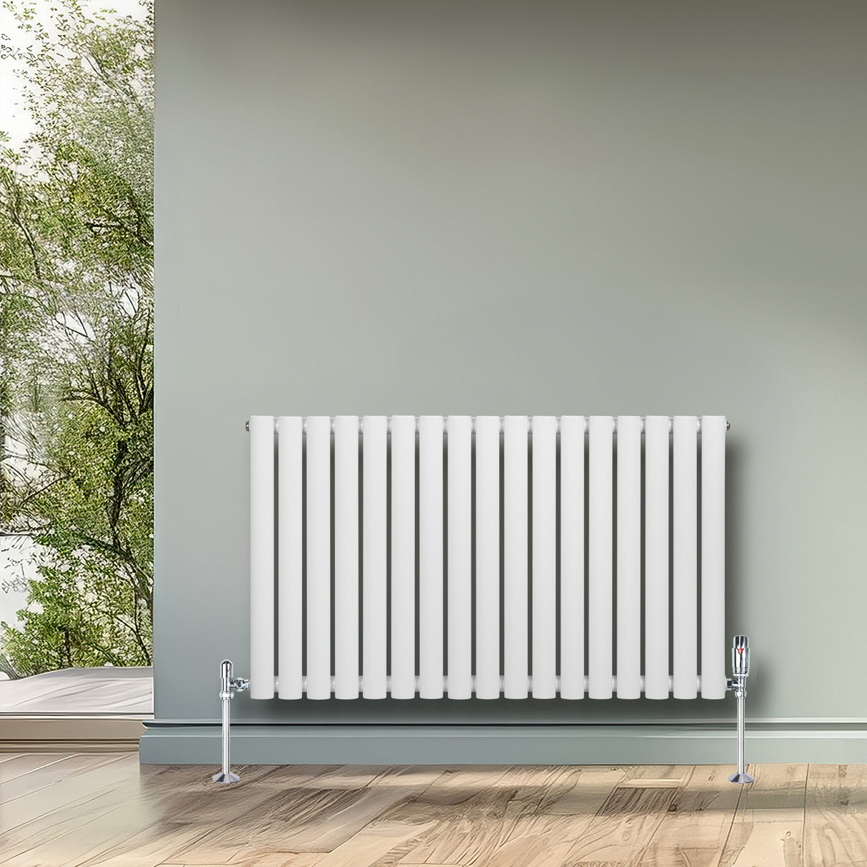 Ovale witte designradiator met één kolom, 600 mm x 1020 mm, geplaatst tegen een groene muur, inclusief haakse thermostaatkraan