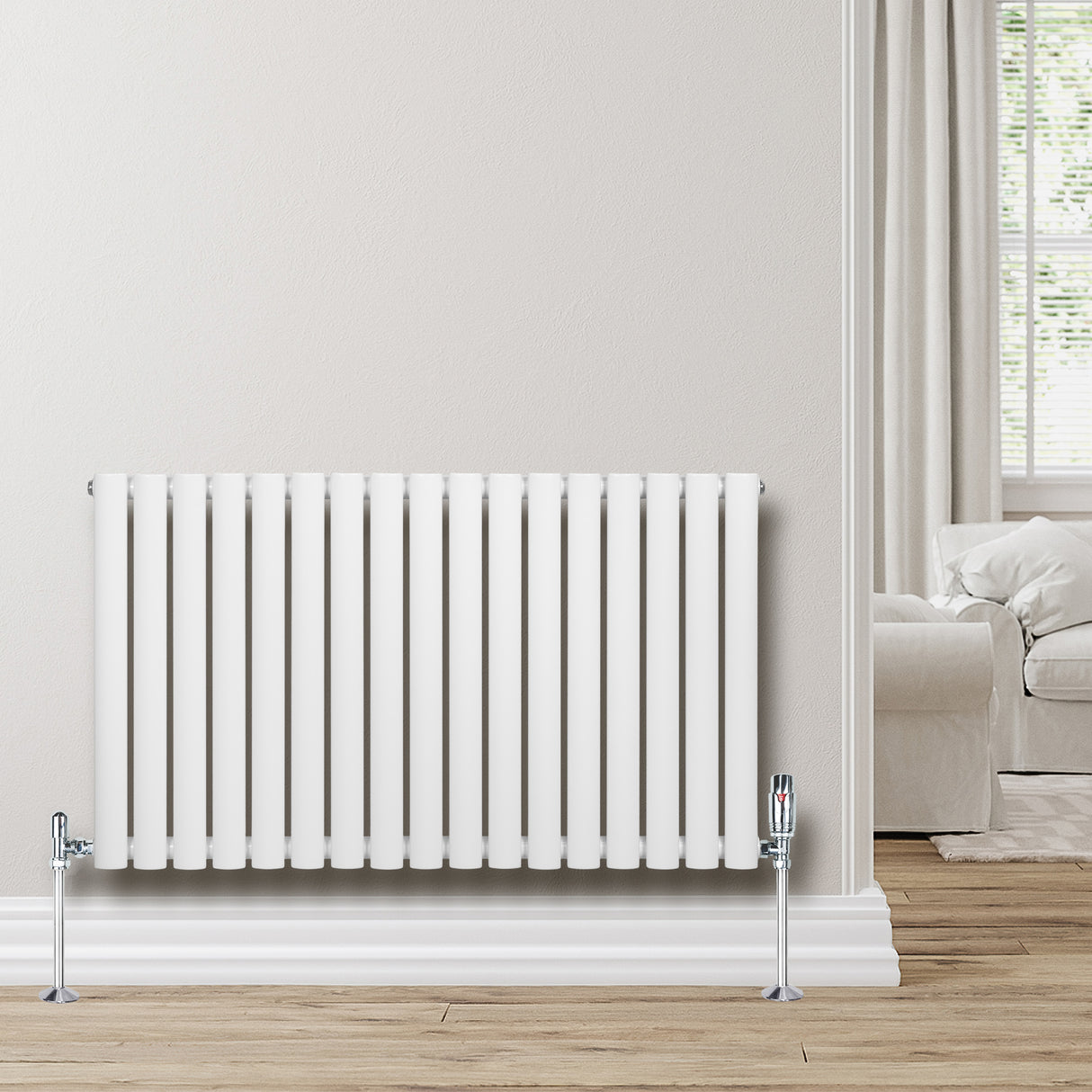 Ovale witte designradiator met één kolom, 600 mm x 1020 mm, inclusief haakse thermostaatkraan, geplaatst tegen een lichte muur