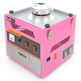 Roze KuKoo suikerspinmachine met metalen bovenkant, knoppen en een glazen venster voor het maken van suikerspin