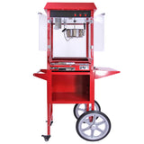 Rode popcornmachine met glazen zijpanelen, metalen ketel en grote wielen, ideaal voor evenementen en feestjes, met gebruiksvriendelijke bediening